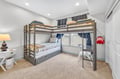 Your kids will love this bright bunk room with comfy beds, soft carpet, and playful touches that make bedtime an adventure.