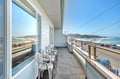 Your private balcony offers front-row seats to endless ocean views and coastal charm.