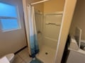 Your private bathroom features a refreshing shower and all essential amenities for a comfortable stay.