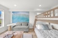 Your coastal retreat awaits with bunk beds perfect for kids, a comfortable pull-out sofa for extra space, and ocean-inspired décor that brings the sea indoors.