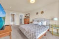 Drift off to sleep in your cozy bedroom featuring soft linens and warm lighting that creates the perfect retreat.