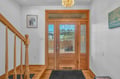 Step into your elegant entryway featuring stunning wood details and gleaming floors that welcome you home after your daily adventures.