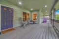 Unwind on your spacious covered porch with comfortable seating where morning coffee tastes better and evening conversations flow naturally.