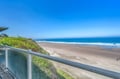 Expansive ocean views stretch endlessly from this elevated coastal property, showcasing pristine sandy beaches and rolling waves.
