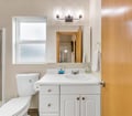 Your private bathroom is spotless and ready for you, with soft towels, natural light from the window, and a clean, modern vanity. Enjoy the peace of a well-maintained space that feels like home.