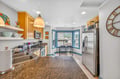 You'll love preparing meals in this bright, fully-equipped kitchen with granite counters, stainless appliances, and charming bay window dining nook.