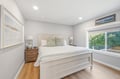 Sink into soft linens and wake to natural light streaming through your window, overlooking lush greenery for a peaceful, restful retreat.