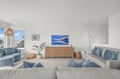 Settle into plush sofas surrounded by coastal hues, where natural light pours in and every detail invites you to unwind in effortless comfort.