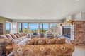 Settle into this spacious living room where ocean breezes and panoramic coastal views stretch as far as the eye can see.