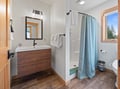 Fresh, modern bathroom with floating vanity and spa-like shower awaits your morning routine.