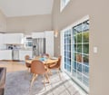 Gather around the bright dining space with soaring ceilings and French doors opening to your private outdoor retreat. The fully-equipped kitchen awaits your morning coffee rituals and evening meal preparations.