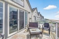 Step onto your private balcony where wicker seating awaits, offering unobstructed beach views and ocean breezes for morning coffee or sunset relaxation.