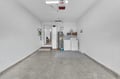 Clean, private garage with laundry facilities including washer and dryer, plus a water heater and ample storage space for your convenience.