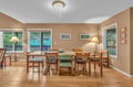 Gather around your spacious dining table where warm wood floors and natural light create the perfect setting for memorable meals together.
