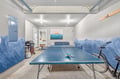 Challenge your friends to ping pong in your private game room, complete with ocean-themed murals and entertainment space.