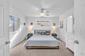 Drift off to sleep in this serene coastal bedroom, where soft natural light and nautical touches create your peaceful retreat. The plush bed awaits you after a day of adventures.