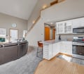 Step into your bright, open living space where high ceilings and natural light create an airy retreat. The kitchen flows seamlessly into the lounge area—perfect for unwinding after a day exploring.