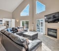 Relax in your sun-drenched living space with soaring cathedral ceilings, plush seating, and a cozy fireplace. Glass doors open to your private deck—perfect for unwinding after a day of adventure.