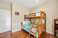 Your kids will love bunking up together in this cozy bedroom, where warm wood floors and soft linens create a restful retreat after a day of adventure.
