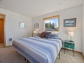 Sink into comfortable bedding while natural light streams through your window, creating a peaceful retreat for restful nights.