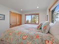 Wake to mountain views through your bedroom windows while colorful sea-themed linens add coastal charm to your restful retreat.