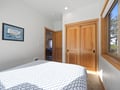 Drift off peacefully in your serene bedroom, where warm wood accents and soft natural light create the perfect retreat for restful nights.