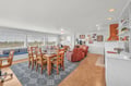 Relax in this bright, open living space where natural light fills your dining and lounge areas, perfect for memorable meals together.