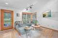 Sink into plush seating where natural light streams through windows, creating your perfect retreat for morning coffee or evening relaxation.