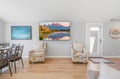 Unwind in this bright, inviting living space where comfortable seating invites you to relax. The open layout flows naturally, perfect for gathering or simply enjoying your peaceful mountain retreat.