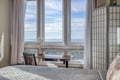 Wake up to breathtaking sea views from your bright bedroom, where you'll enjoy morning coffee at your private desk overlooking endless ocean horizons.