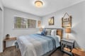 Drift off to sleep in this coastal-inspired bedroom where soft blue linens and charming nautical décor create your perfect beach retreat. Wake up refreshed with natural light streaming through your window.