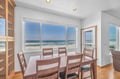Savor your morning coffee at this ocean-view dining table, where endless waves become your backdrop for every meal together.