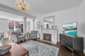 Relax in your elegant living room, Note: fireplace is decorative only, crystal chandelier, and TV for perfect evenings in.