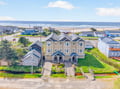Modern beachside vacation rental featuring duplex units with ocean access and coastal neighborhood charm.