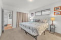 Drift into peaceful sleep in your coastal-themed bedroom, where starfish bedding and warm lighting create the perfect retreat.