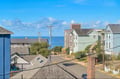 A charming coastal neighborhood where residential streets slope gently toward the Pacific Ocean. The property offers a peaceful setting with glimpses of the sea between nearby homes.