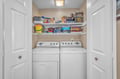 Your own in-home laundry closet features full-size washer and dryer, plus shelving stocked with games for cozy evenings together.