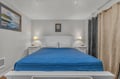 Sink into this comfortable bed with crisp linens and soft lighting creating your perfect retreat for restful nights.