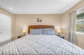 Sink into this comfortable bed with soft linens and gentle bedside lighting for your perfect night's rest.