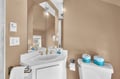 Step into your private sanctuary with elegant marble vanity, brass fixtures, and thoughtful amenities for your comfort.