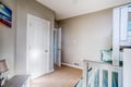 Your upper-level retreat offers peaceful moments between bedroom doors, with soft carpet underfoot and natural light streaming through skylights above.