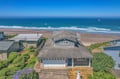 Oceanfront property with stunning beach access and expansive coastal surroundings.